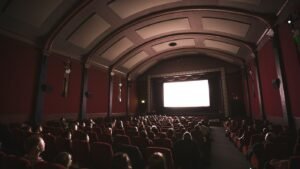 Audience watching a film in a dark cinema