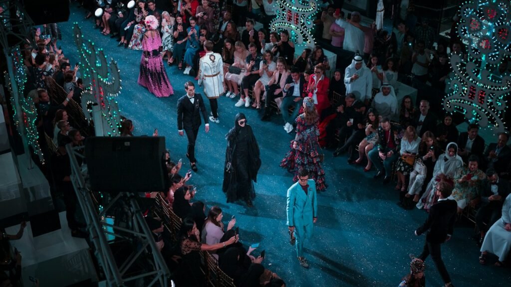 Models walking on a fashion show stage